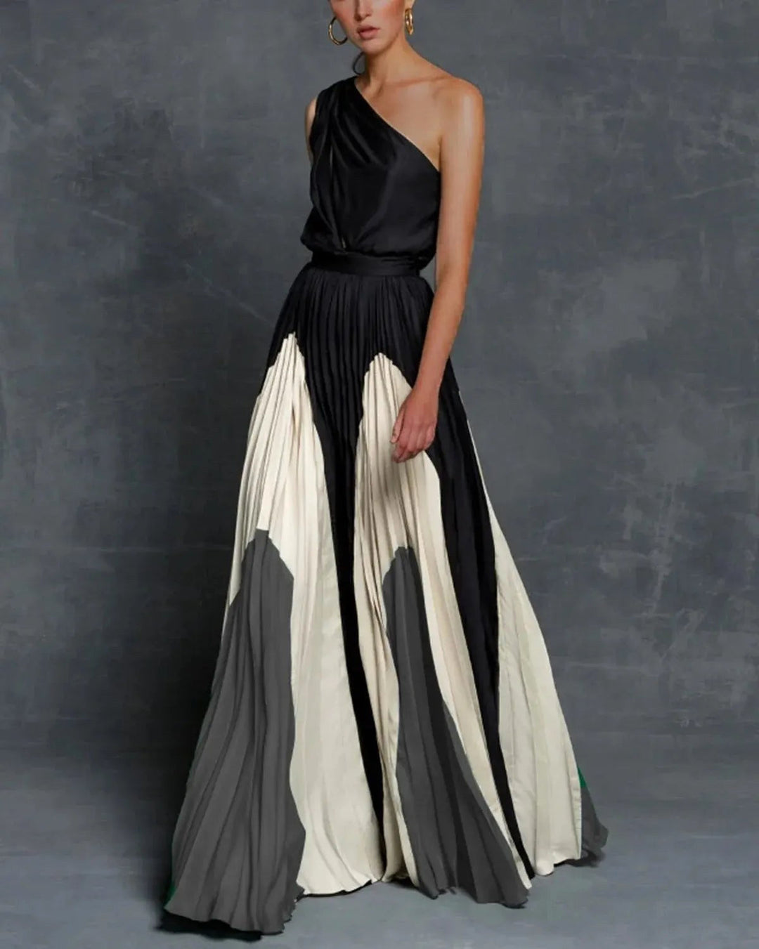 Comfortable grey women's maxi dress, designed with elegant statement shoulders for a sophisticated special occasion look.