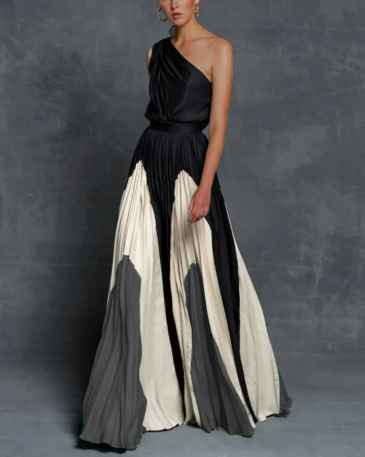 Comfortable grey women's maxi dress, designed with elegant statement shoulders for a sophisticated special occasion look.
