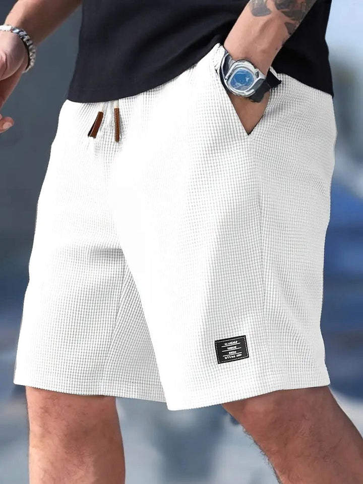Comfortable men's relaxed-fit summer shorts, versatile for casual wear, travel, and outdoor use.