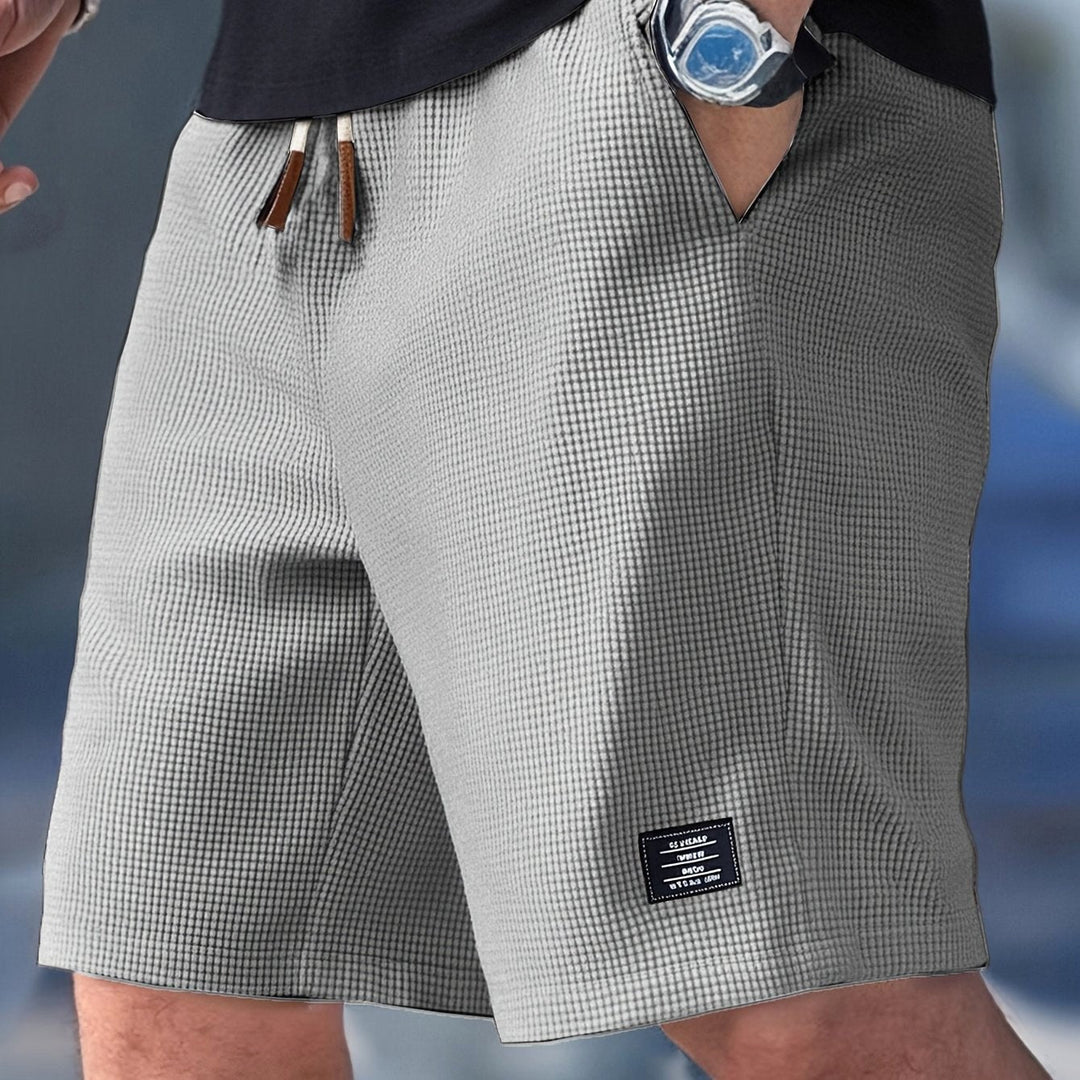 Practical men's relaxed-fit summer shorts with pockets, ideal for comfortable casual and travel wear.