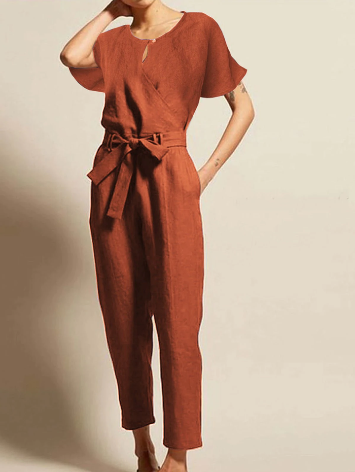 Radiant women's summer jumpsuit with short sleeves and a chic belt. Perfect elegant one-piece for day or night.