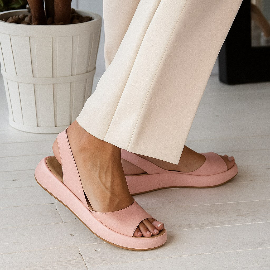 Stylish women's open toe flat sandals, perfect slip-on summer footwear for casual outings.