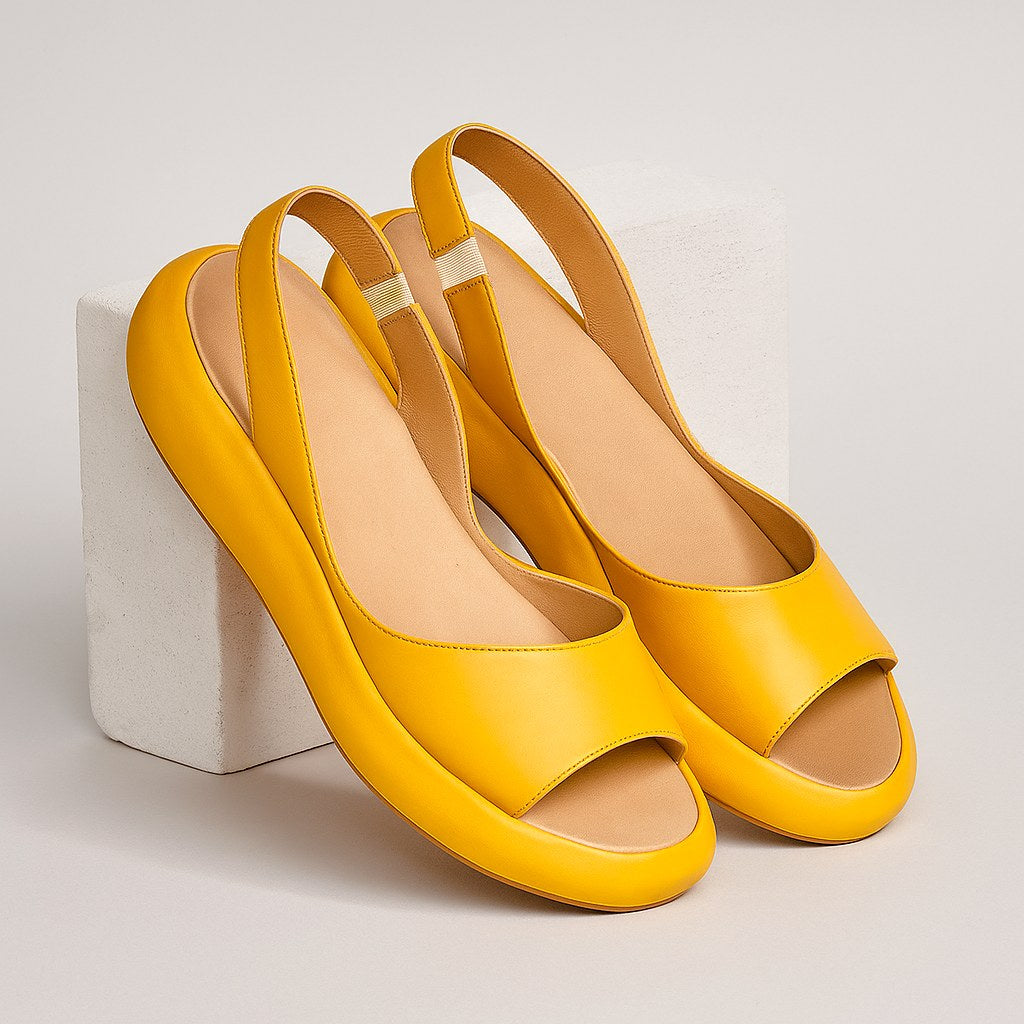 Minimalist women's flat open toe sandals. Comfortable slip-on casual shoes for everyday summer wear.