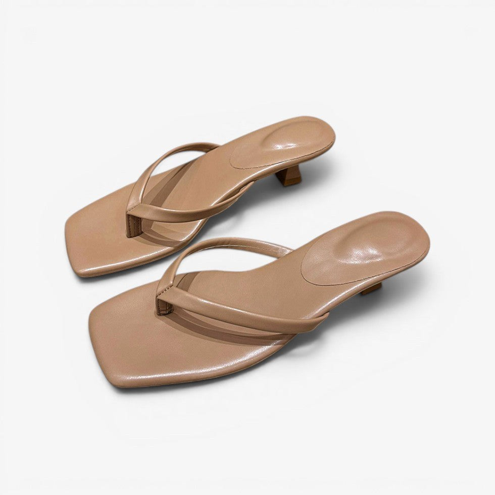 Minimalist women's thong block heel sandals. Perfect summer shoes for casual wear or elegant evening outings.