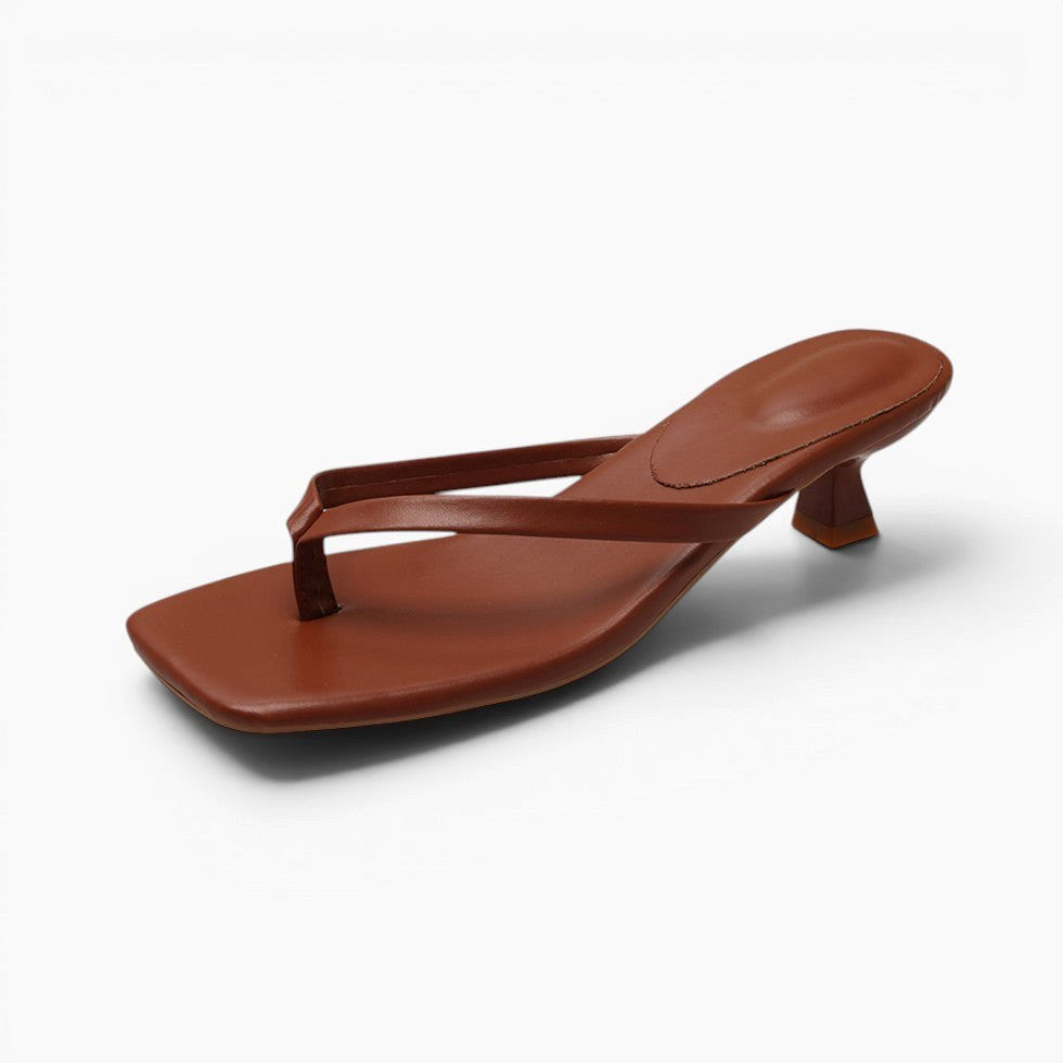 Elegant women's thong sandals with sturdy block heel. Minimalist design offers comfort for casual or evening wear.
