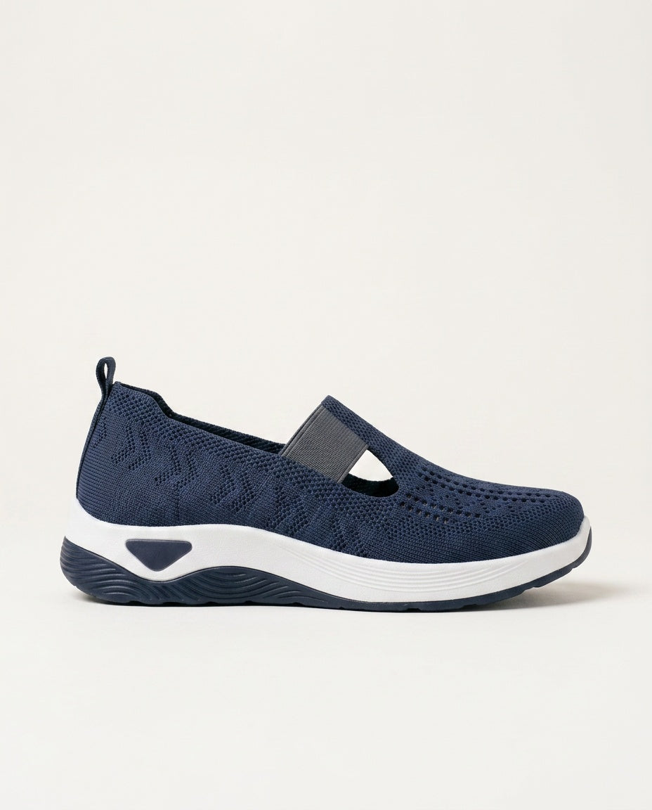 Women's chic navy slip-on orthopedic shoes with cushioned arch support, ideal for comfortable everyday walking.