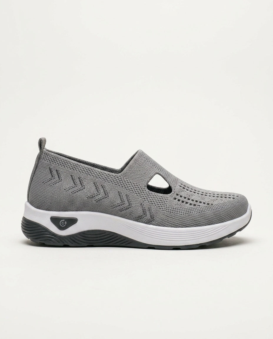 Grey women's orthopedic slip-on shoes with arch support & cushioning, great for comfortable feet.