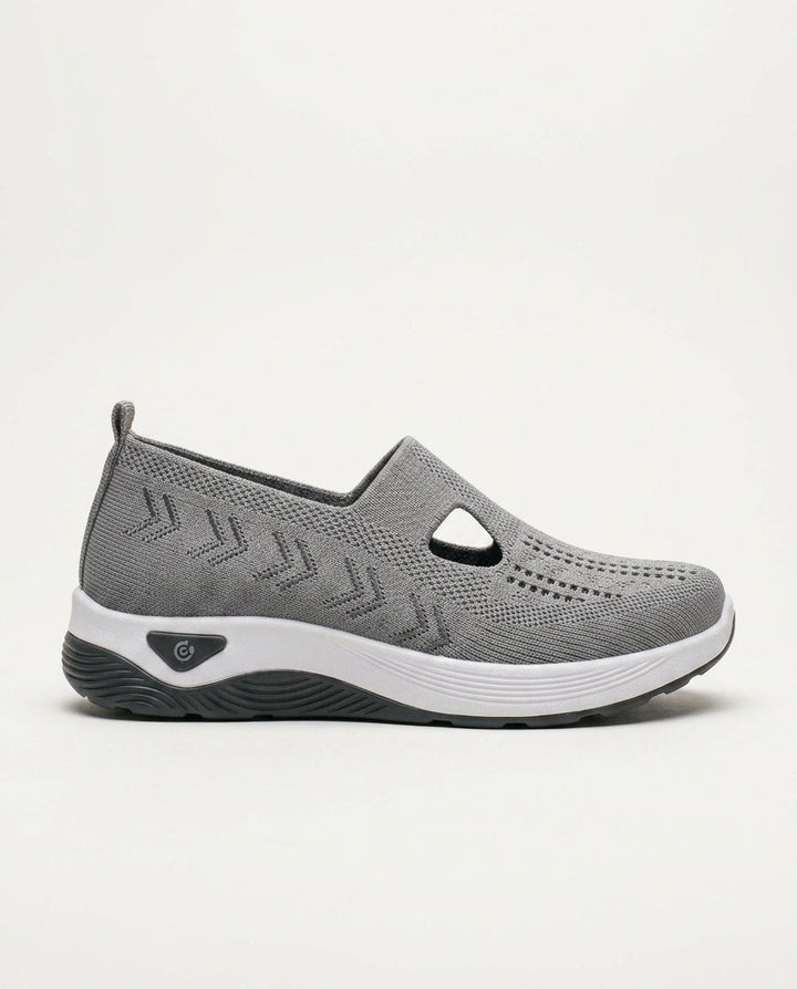 Grey women's orthopedic slip-on shoes with arch support & cushioning, great for comfortable feet.