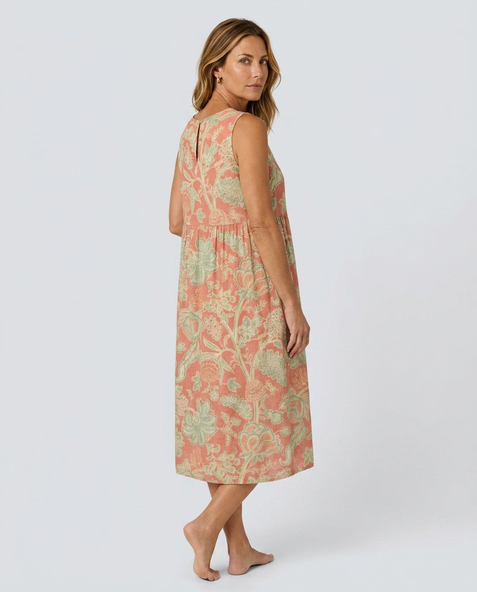 Comfortable red floral print sleeveless midi dress, ideal for summer vacations. Elegant women's round neck gathered waist dress.