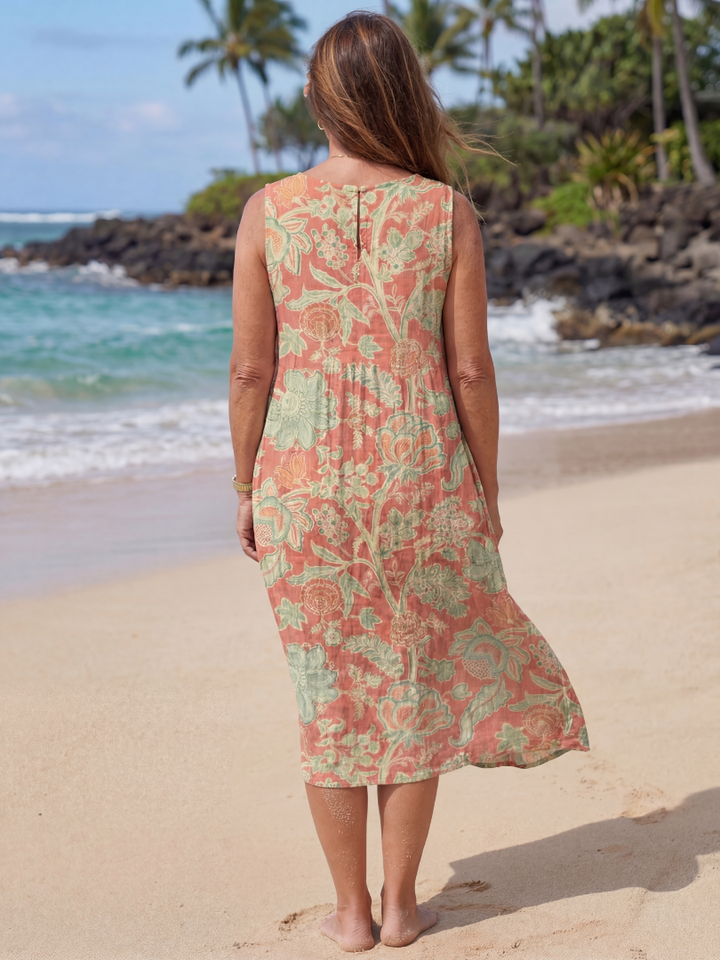 Women's effortless red floral print midi dress with gathered waist & round neck. Sleeveless, elegant & comfortable for summer.