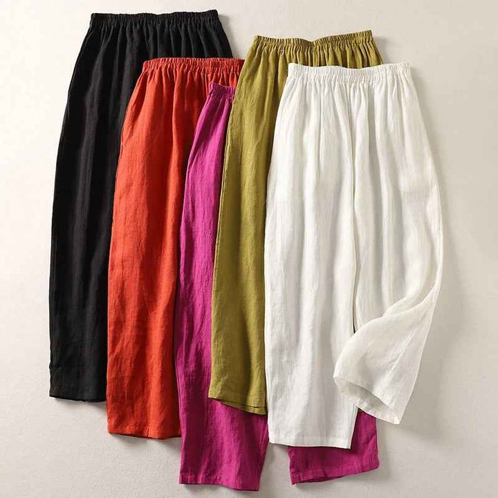Flowy women's linen wide leg pants featuring a relaxed fit & elastic waist. Ideal for comfortable summer style.