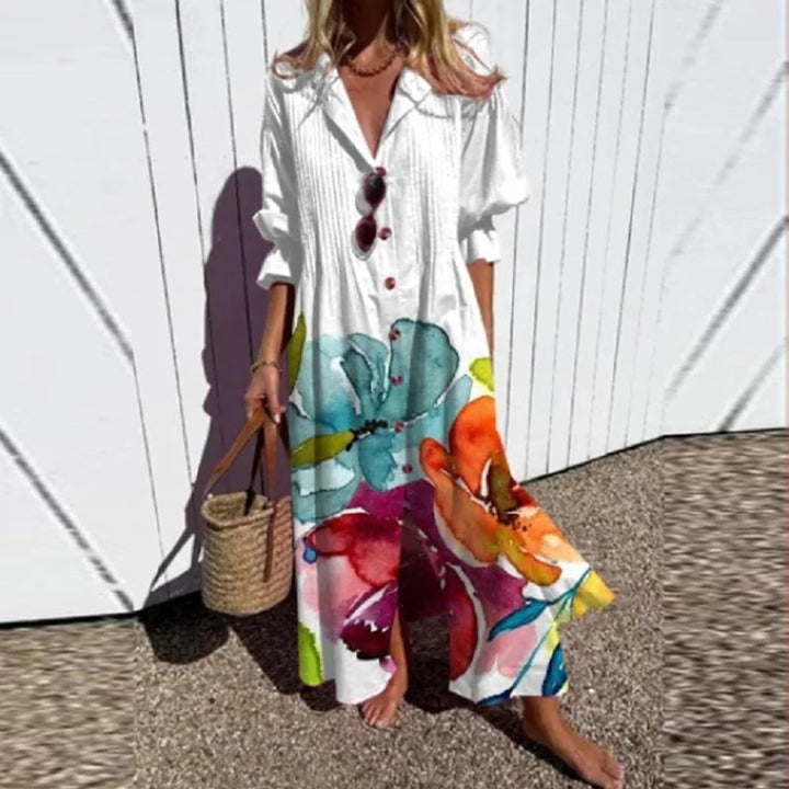 Woman wearing a relaxed, flowing V-neck floral boho maxi dress. Great for summer strolls or resort wear.