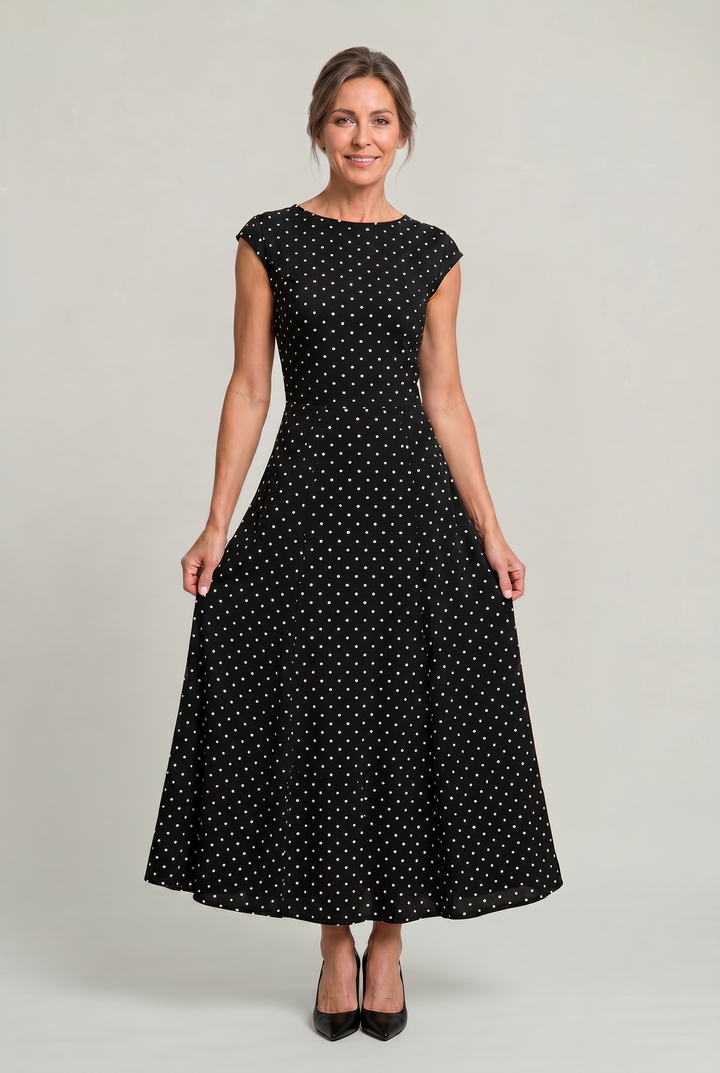 Women's timeless polka dot maxi dress with elegant cap sleeves, perfect for special occasions or parties.