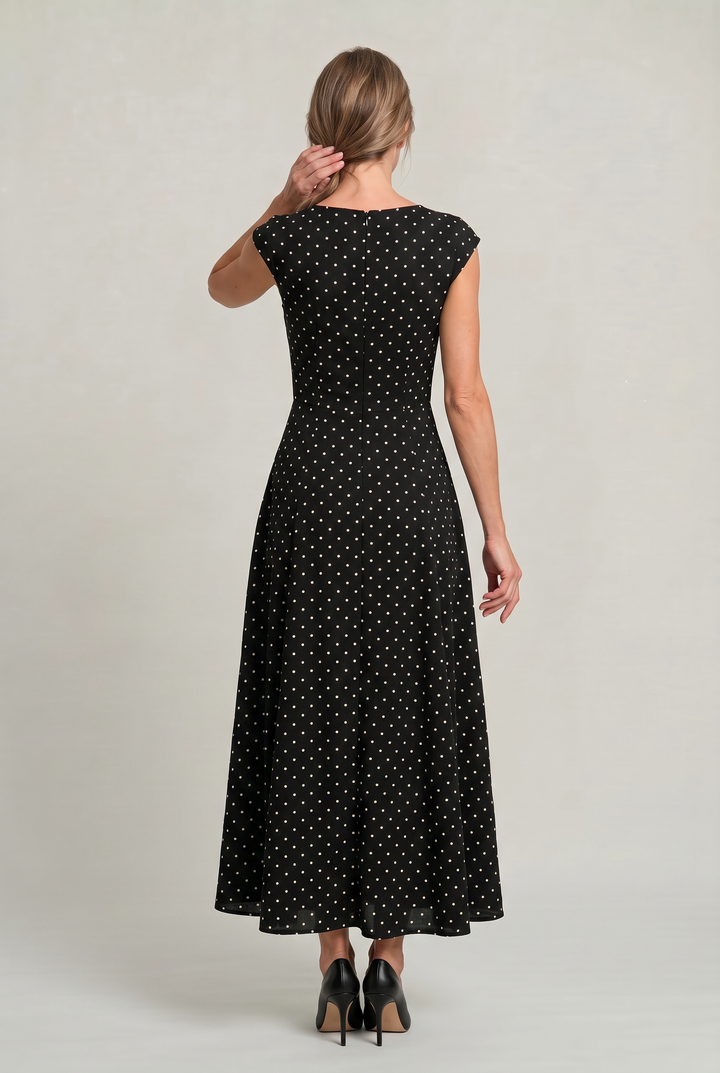 Stylish women's printed polka dot maxi dress with cap sleeves, a timeless choice for cocktail parties.