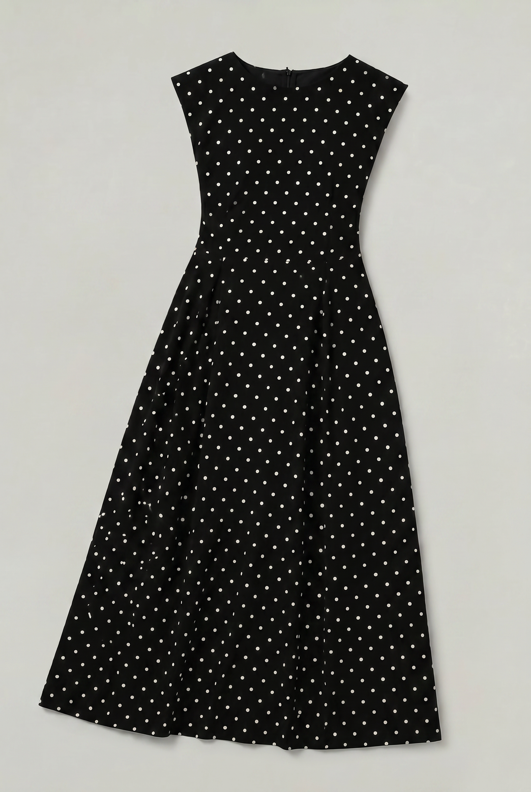 Women's flattering polka dot maxi dress featuring cap sleeves and a chic fit and flare silhouette.