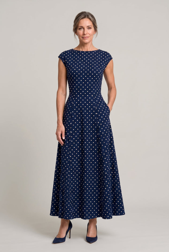 Classic women's polka dot printed maxi dress with subtle cap sleeves, ideal for elegant formal wear.