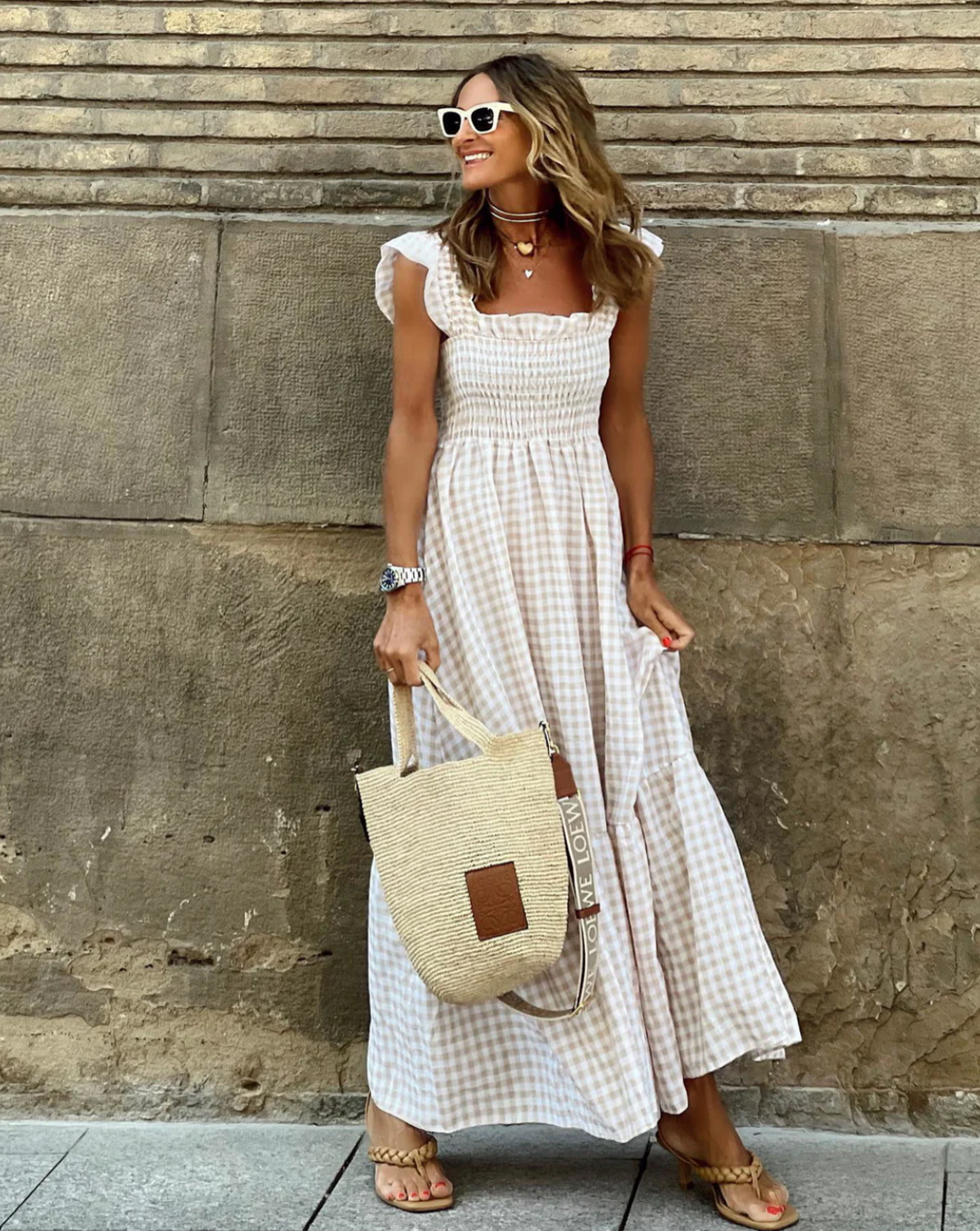 Women's timeless smocked gingham maxi dress with delicate flutter sleeves, perfect for summer casual wear.