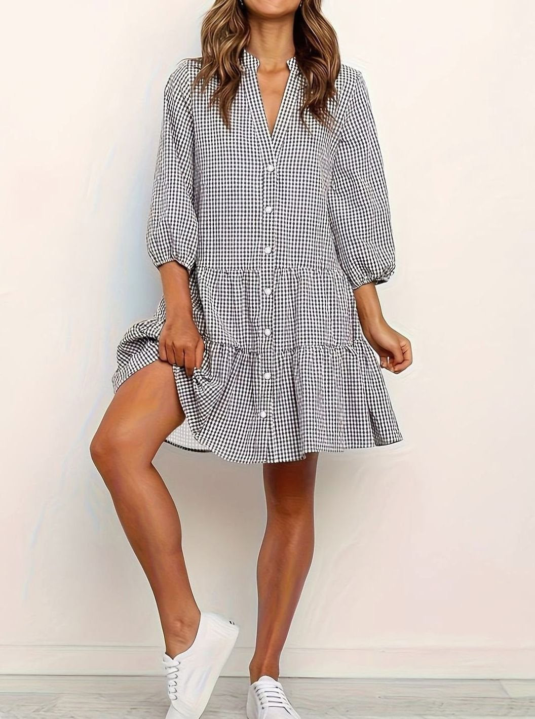 Flowy gingham mini dress with puff sleeves and tiered skirt, ideal for brunch or summer casual wear.