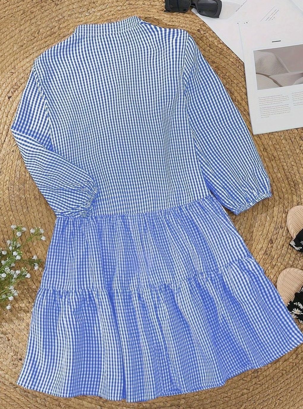 Chic women's tiered mini dress with playful puff sleeves, a stylish and flowy gingham summer outfit.