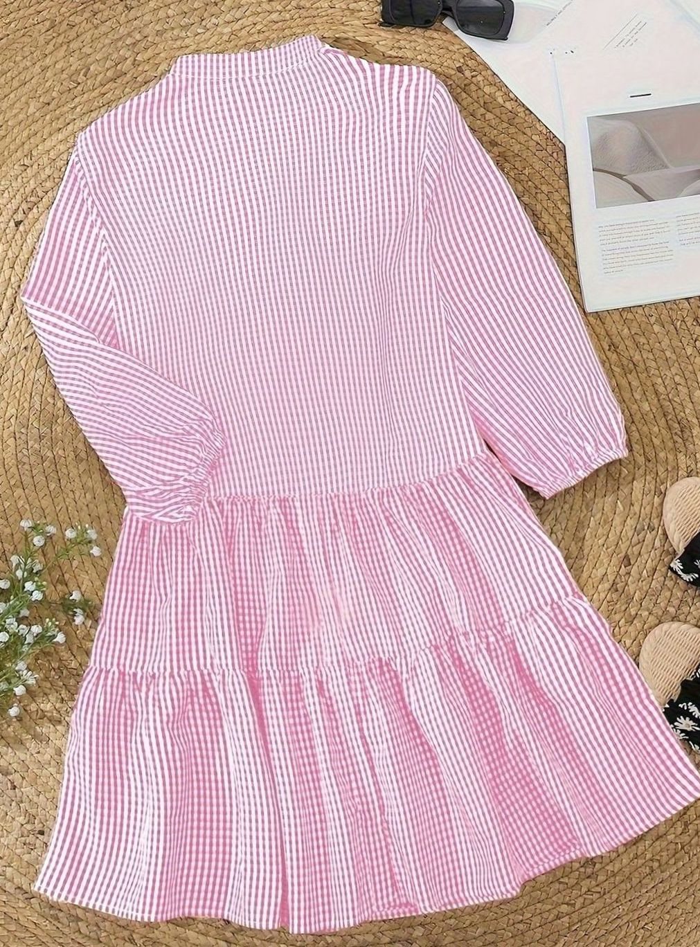 Front view of women's gingham mini dress, showing tiered skirt, puff sleeves, and chic casual design.
