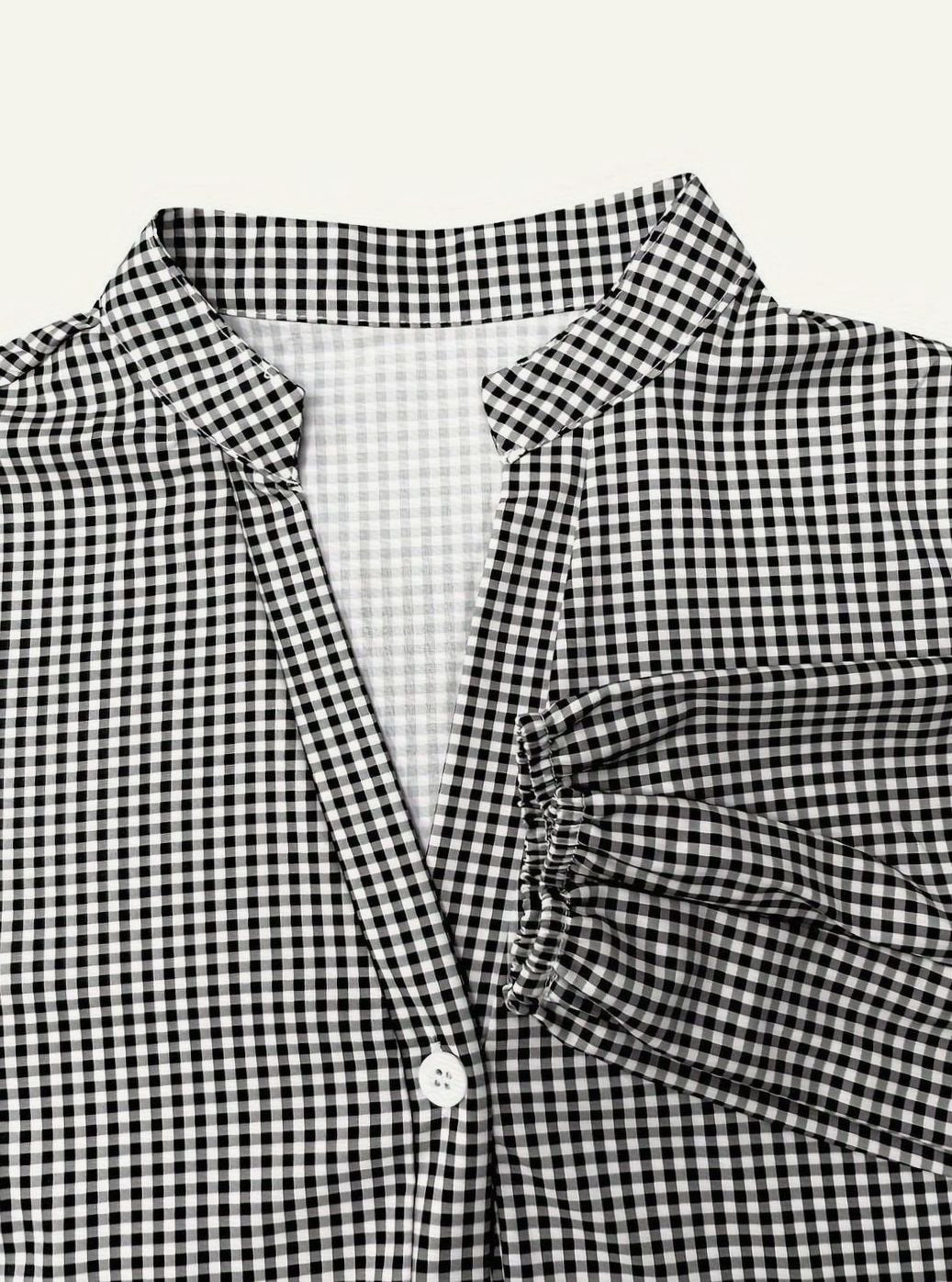 Stylish women's tiered gingham dress, a short summer mini with puff sleeves and a comfortable flowy fit.
