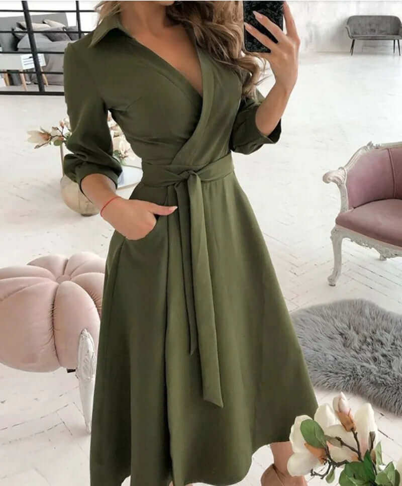 Sophisticated women's wrap midi dress featuring a collar & tie waist. Versatile A-line cocktail dress.