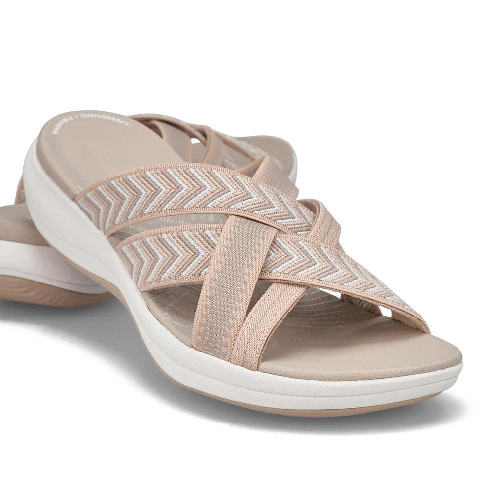 Cushioned cross-strap slip-on sandals for women, offering sophisticated style & everyday comfort.