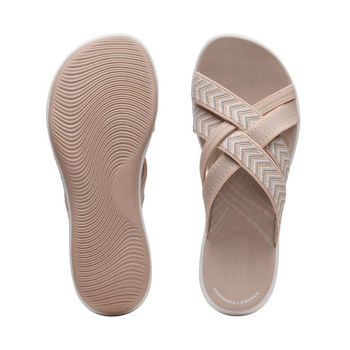 Elegant women's sandals featuring a comfortable cushioned sole and stylish cross-straps.