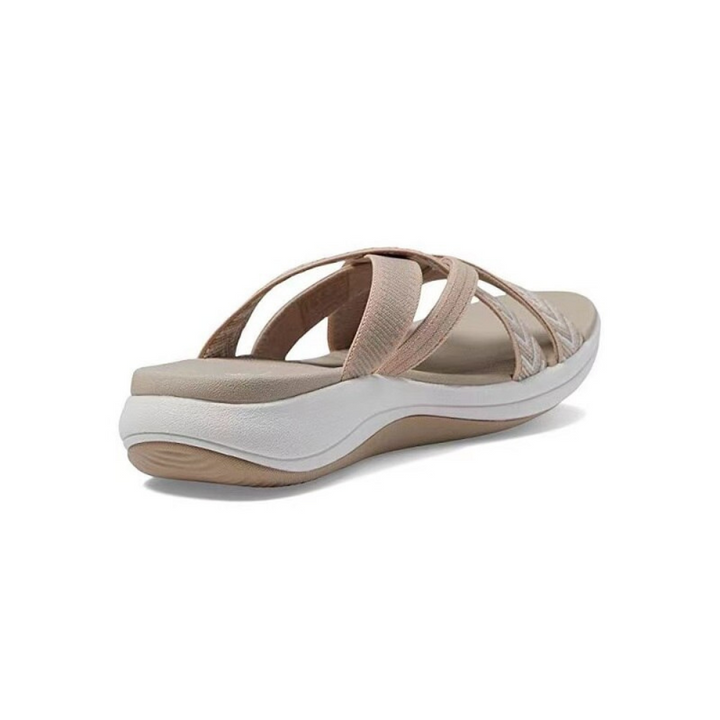Summer-ready women's comfort sandals with cushioned cross-straps and slip-on design.