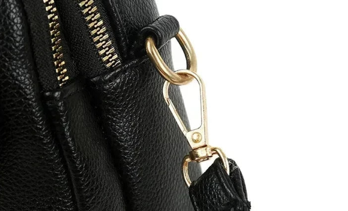 Front view of a women's retro fashion genuine leather shoulder bag handbag.