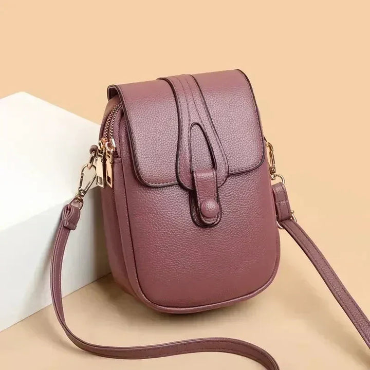 Close-up of the texture on a genuine leather women's vintage style shoulder bag.