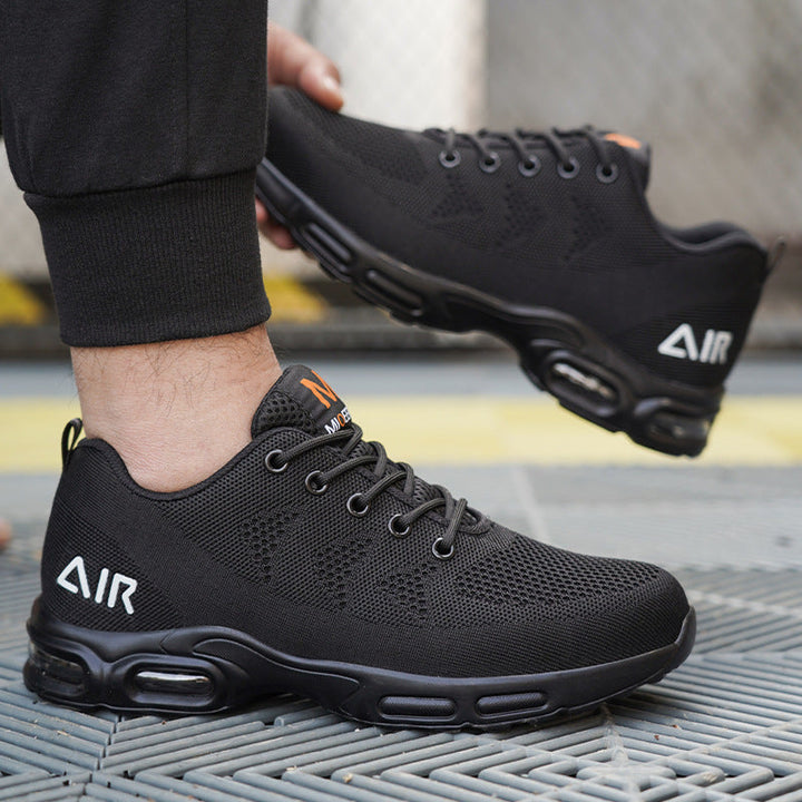 Stylish and protective mens footwear: black water-resistant safety shoes designed for all-day comfort.