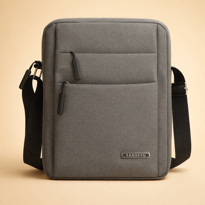 Minimalist grey crossbody handbag for men, perfect for urban exploration.