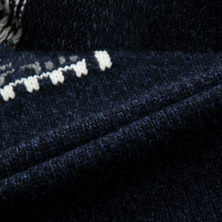 A man wearing a full zip patterned cardigan. Comfortable, fashionable long sleeve knit sweater for a modern layered look.