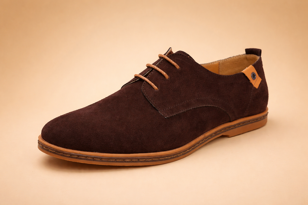 Close-up of men's elegant oxford shoes featuring detailed stitching and lace-up closure.