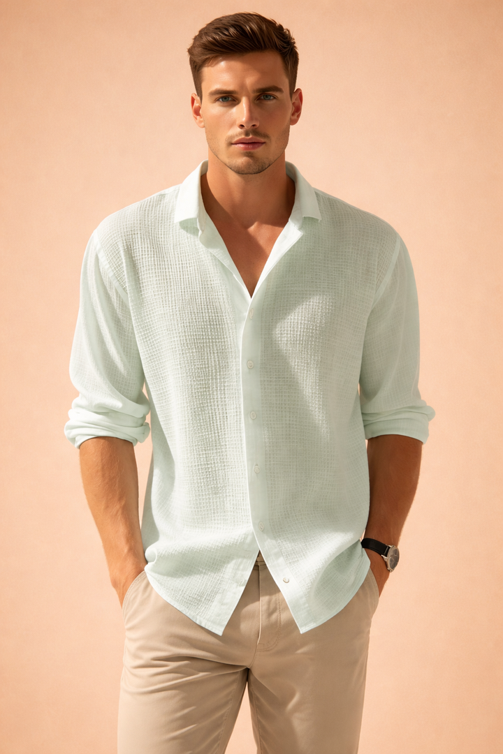 Relaxed fit men's button-up long sleeve shirt. Ideal for casual outings or smart-casual summer events.