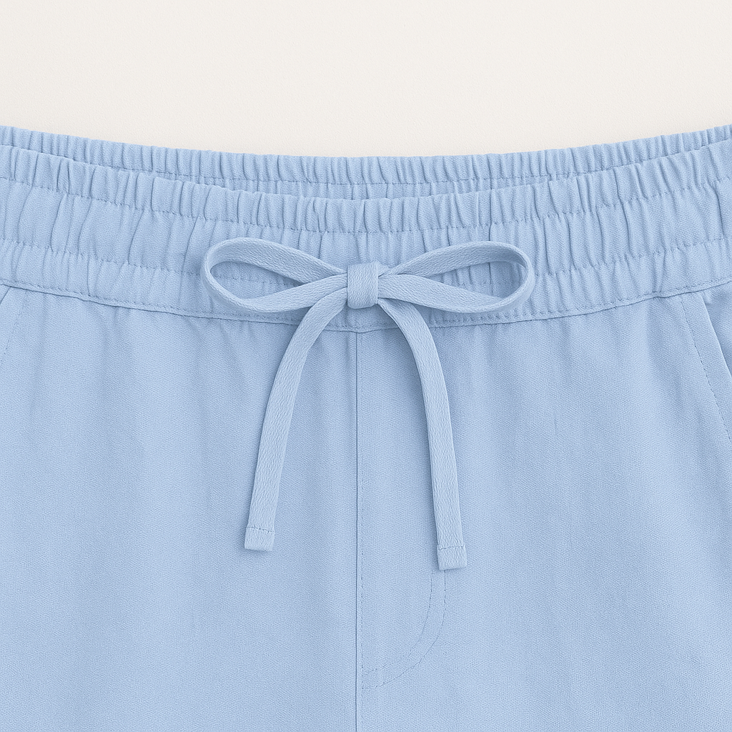 Men's versatile casual outfit: button-up shirt & drawstring shorts. Ideal for summer style and comfort.