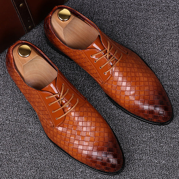 Men's classic brown leather lace-up dress shoes for formal or smart casual wear.