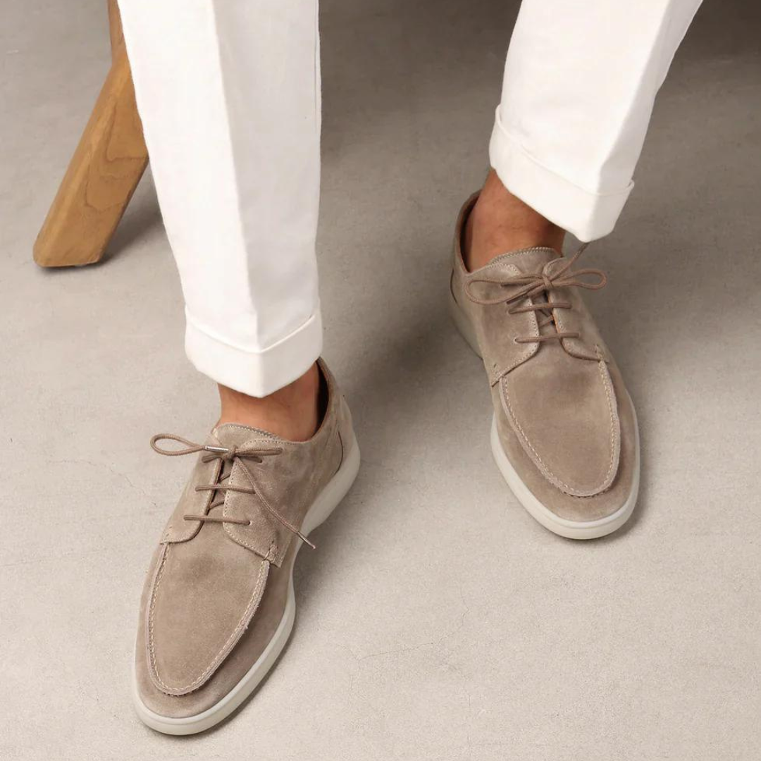 Men's classic brown leather lace-up loafers, perfect for business or casual wear.
