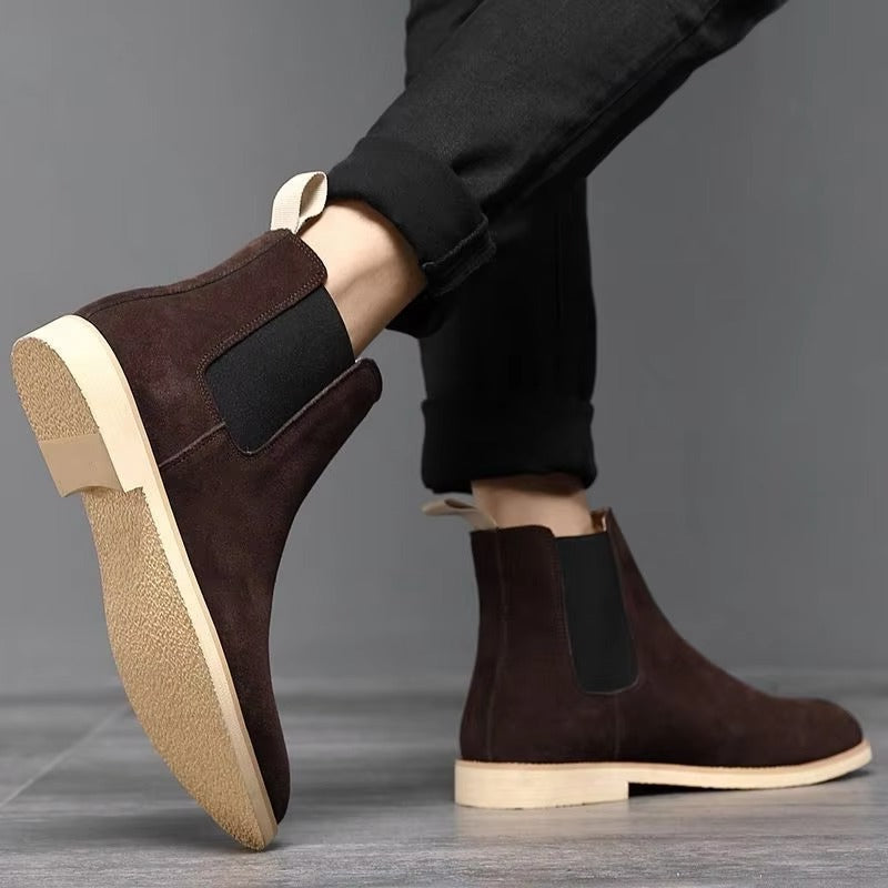 Close-up of men's casual fashion ankle boots in a faux suede finish, elastic side panels.
