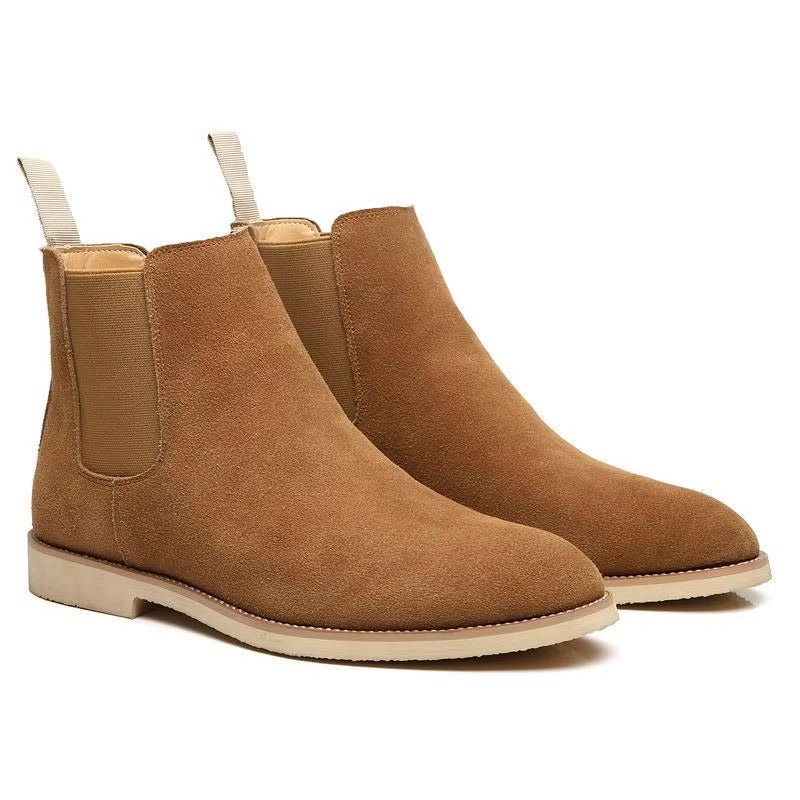 Front view of men's black Chelsea boots, offering a sleek suede-look silhouette.