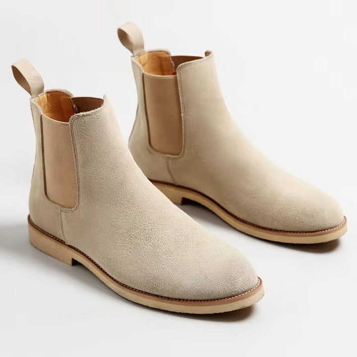 Detail shot of the stitching and texture on men's faux suede slip-on ankle boots.