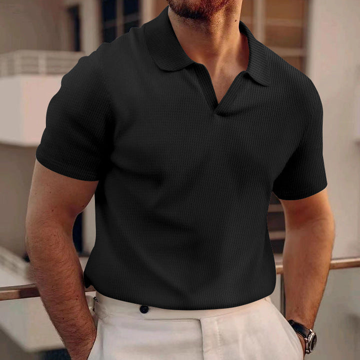 Model wearing a versatile men's casual polo shirt for summer style.