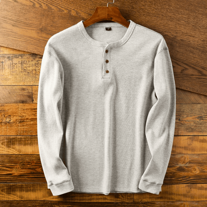 Men's classic henley neck t-shirt in a soft cotton blend, perfect for casual wear.