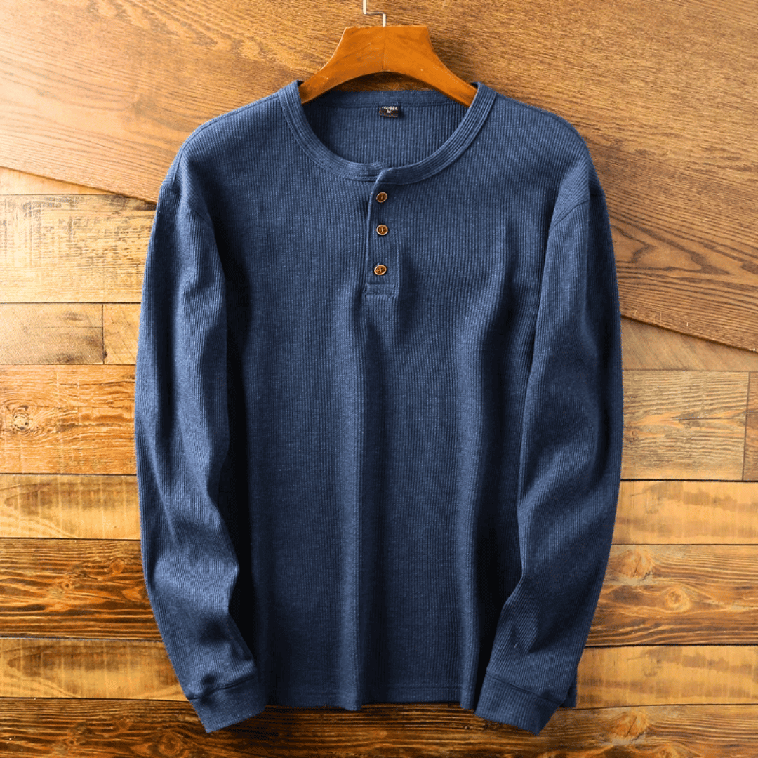 Close-up of the henley neckline on a men's classic t-shirt, highlighting ribbed cuffs.
