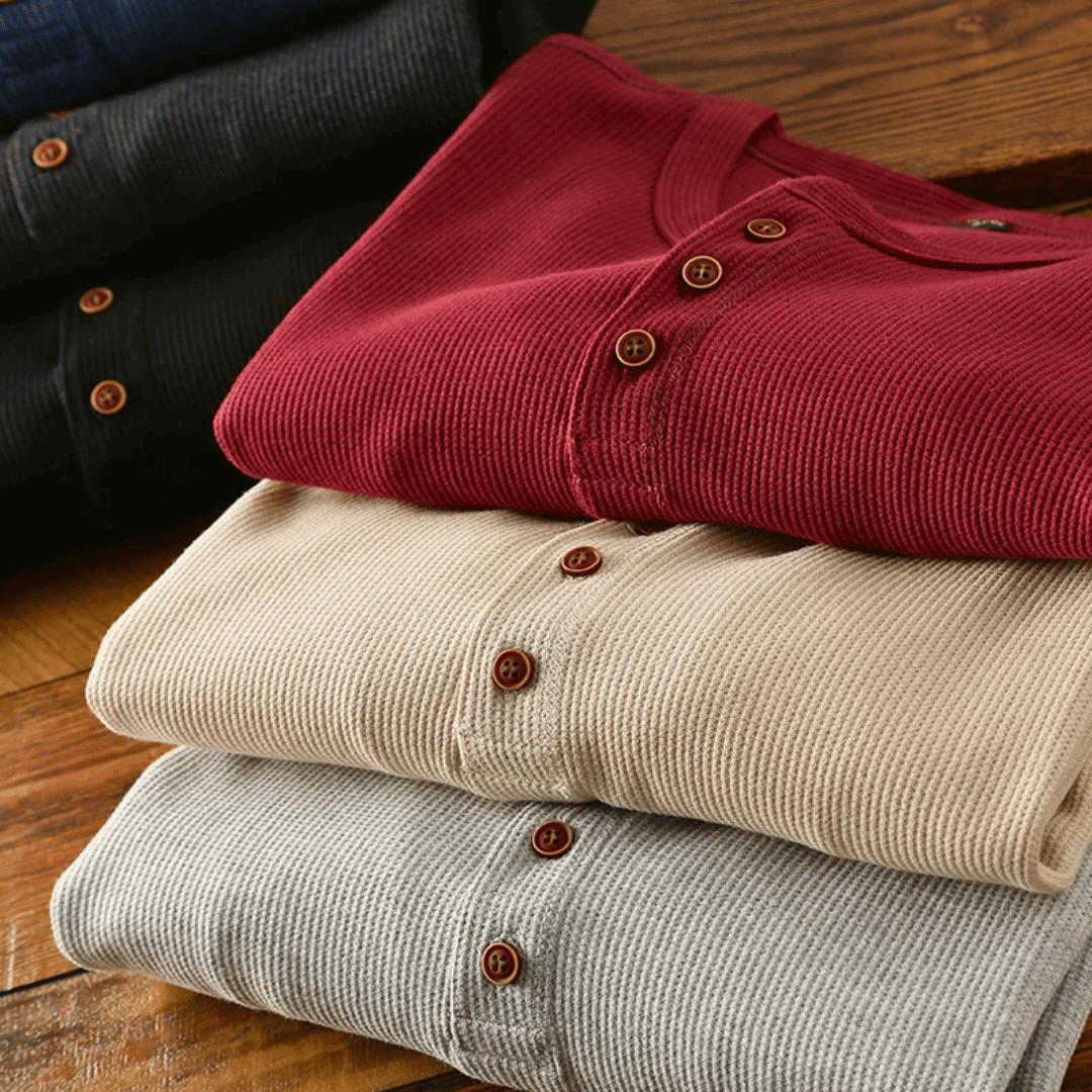 A men's comfortable henley shirt in a neutral color, showcasing its timeless design.
