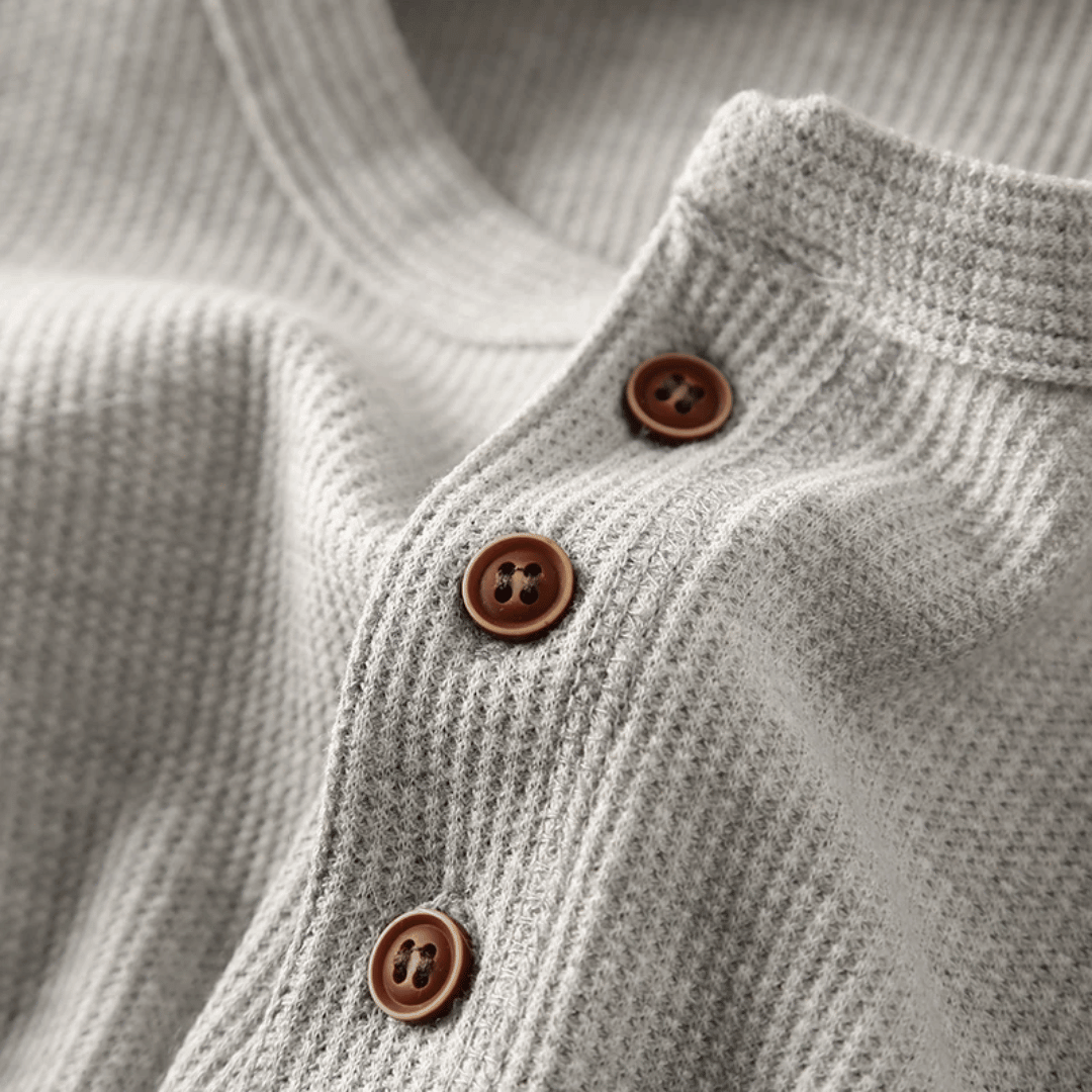Outfit idea: Men's henley neck t-shirt paired with jeans for a relaxed, classic look.