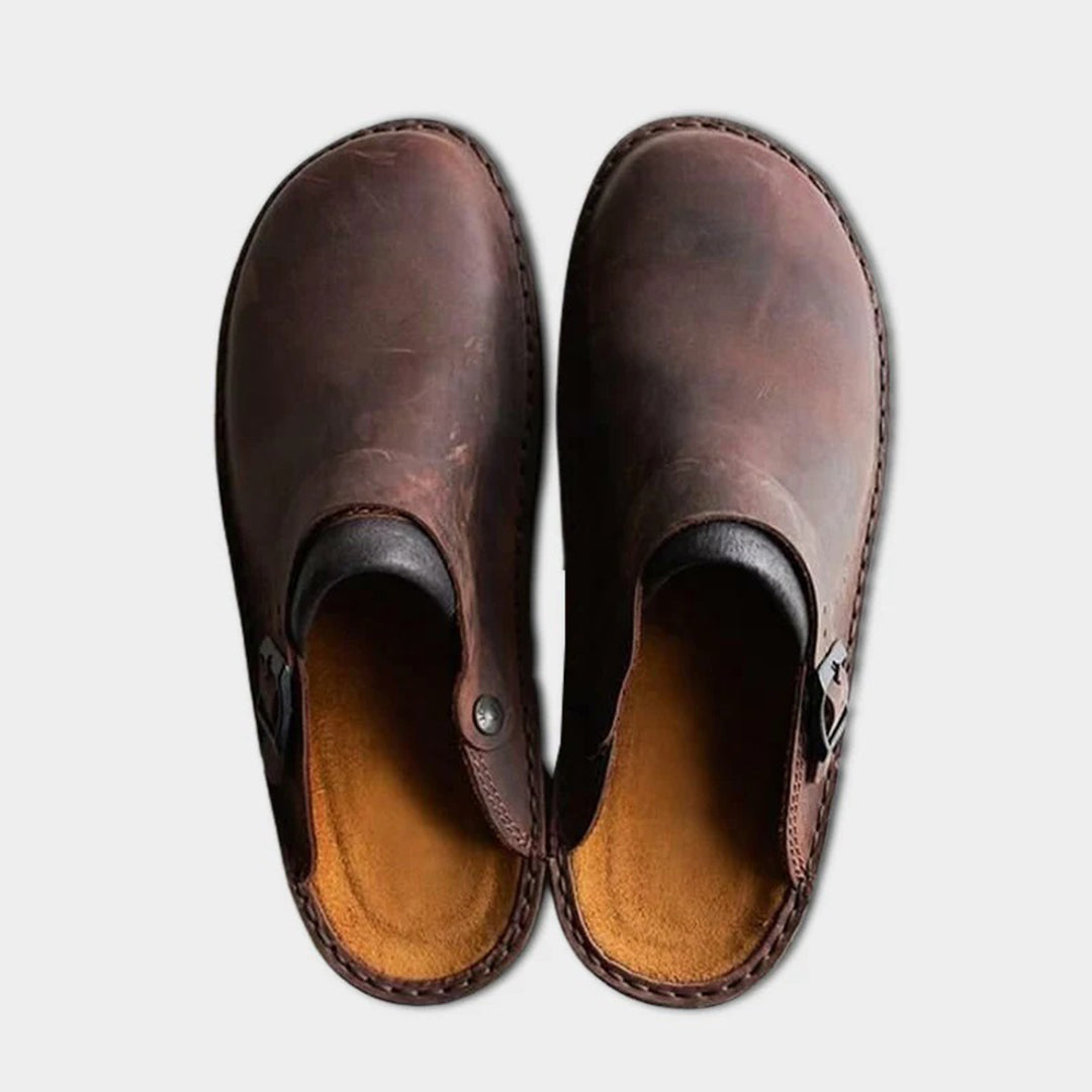 Men's classic slip-on leather "Victor" house slippers, designed for comfort, relaxation & versatile indoor-outdoor wear.