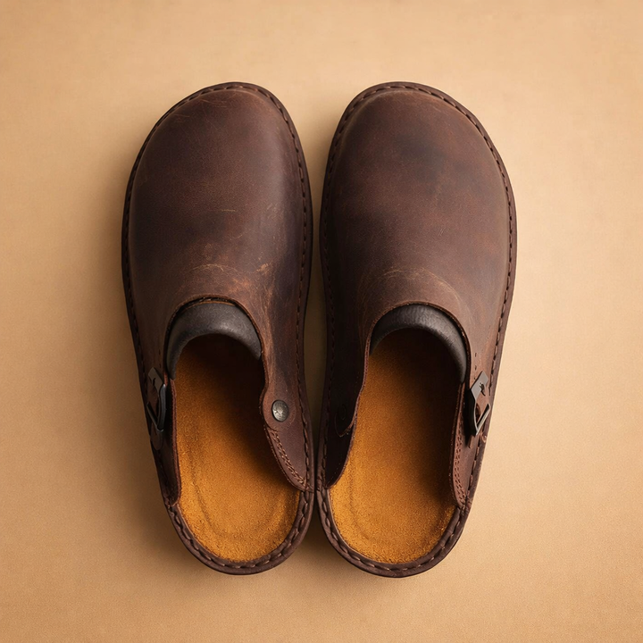 Men's comfortable slip-on clogs featuring an adjustable strap for a secure fit.