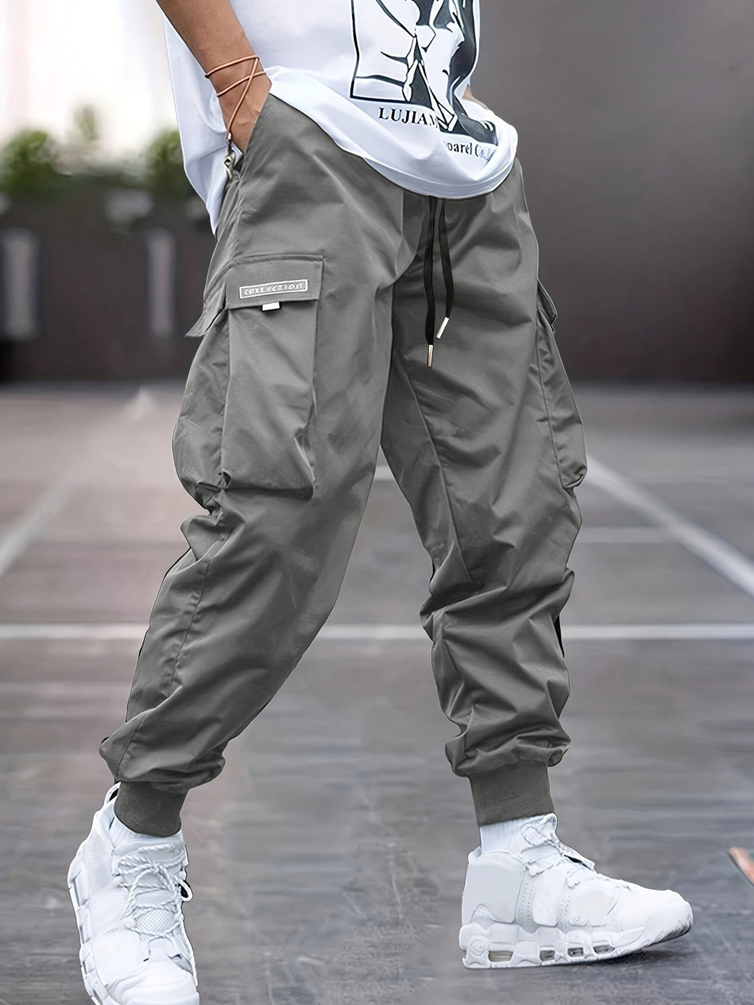 Comfortable men's drawstring cargo pants, relaxed fit, multi-pocket utility design for versatile outdoor wear.